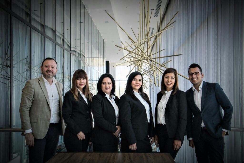 A sales team standing side by side.