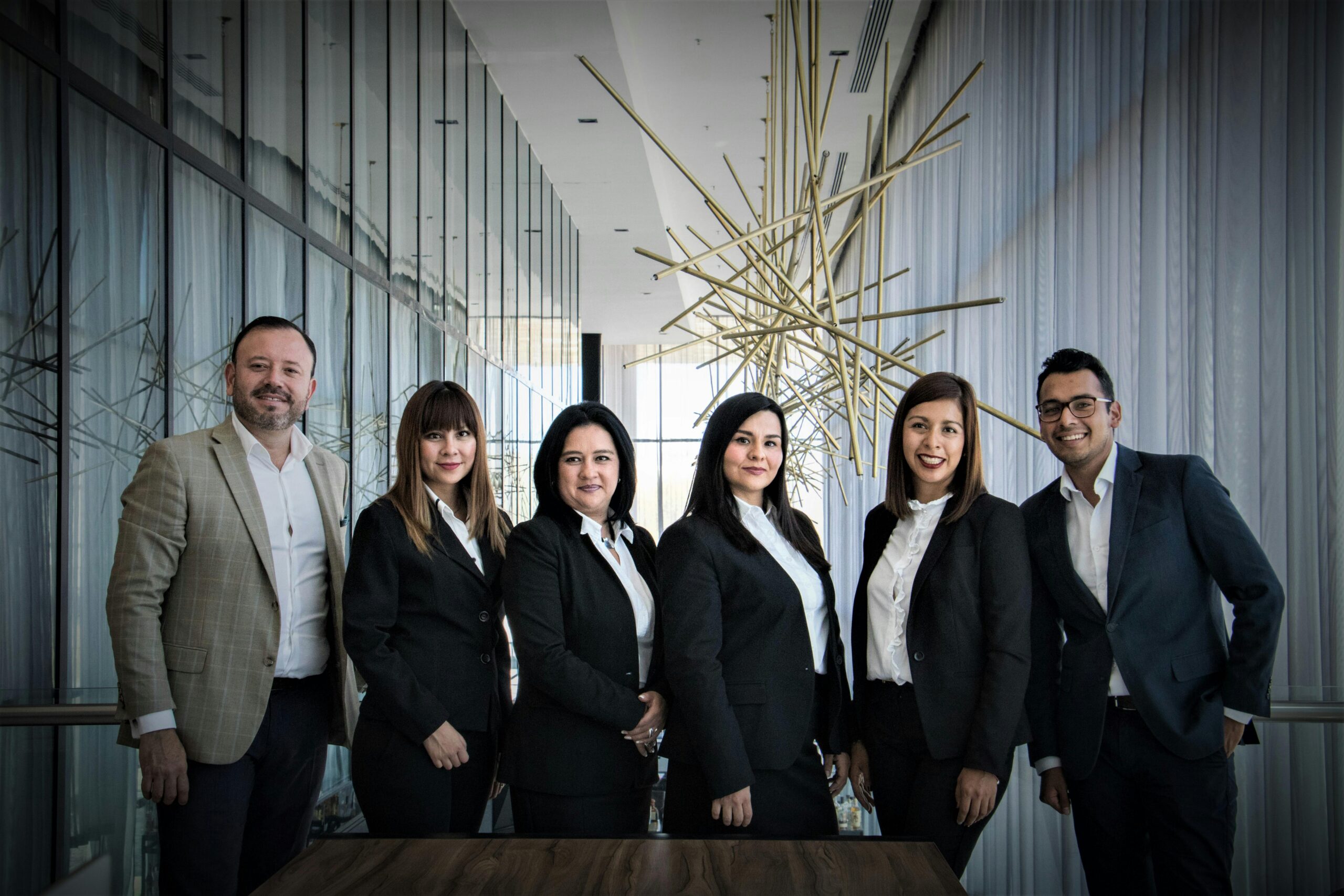 A sales team standing side by side.